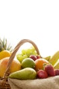 Horizontal Closeup detail on a basket full of fruit on white background Royalty Free Stock Photo